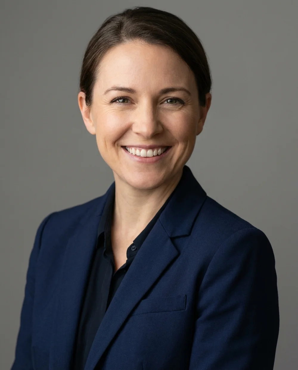 Professional headshot - woman in corporate navy attire