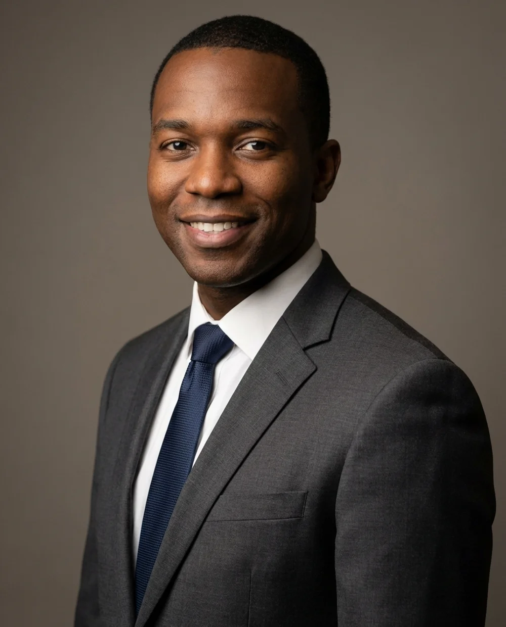 Professional headshot - man in charcoal suit
